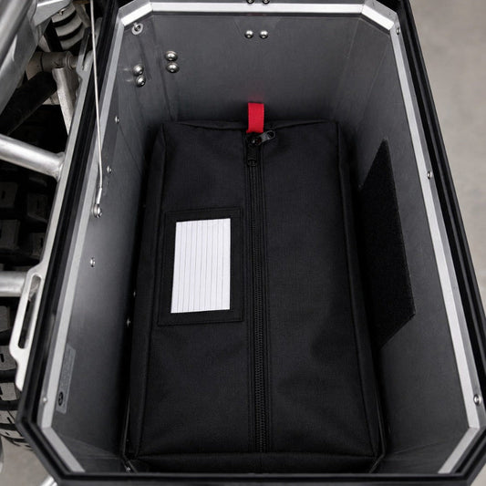 Moto Pockets Stuff Bags organizing gear inside a motorcycle pannier