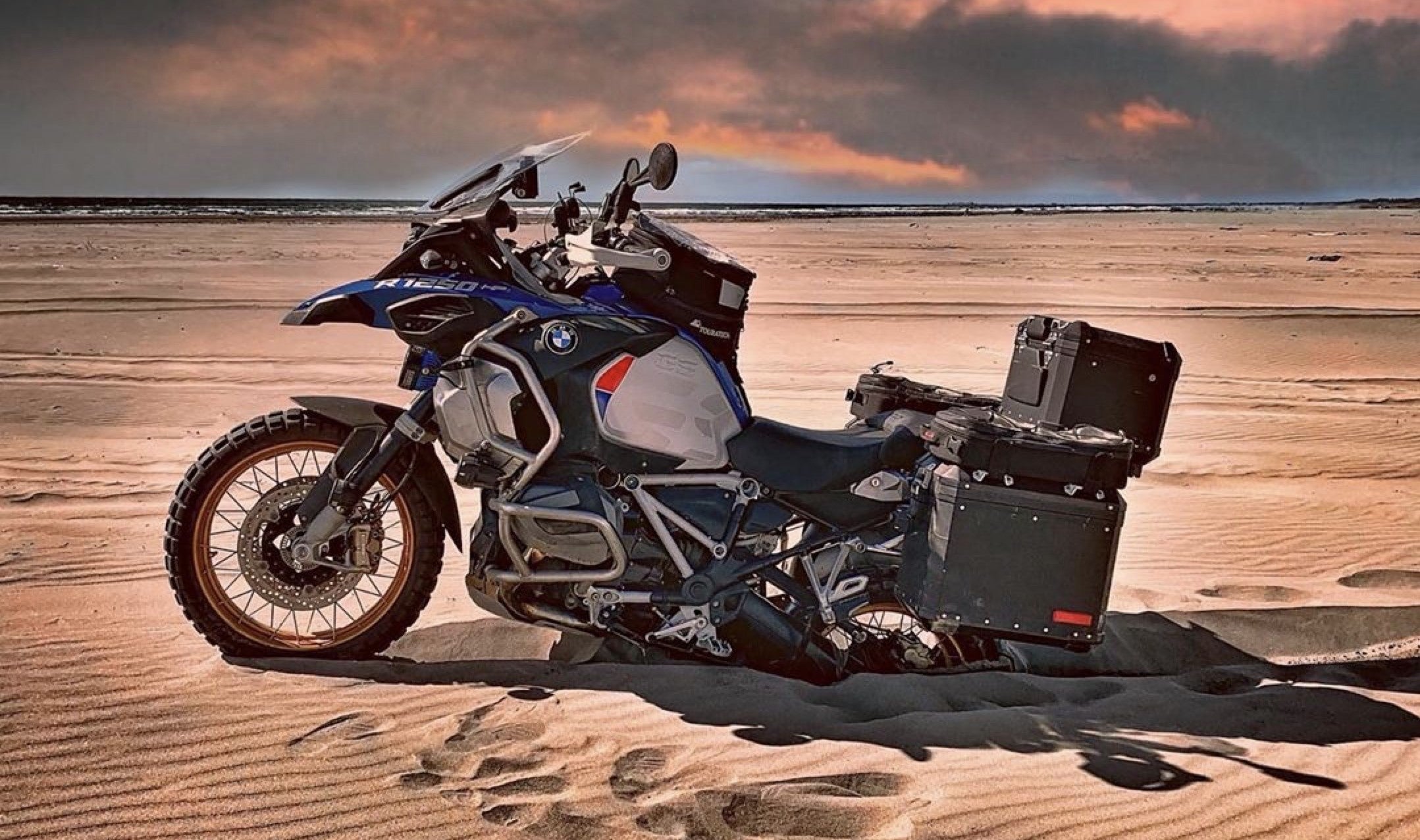 BMW GS 1250 stuck in sand with moto pockets bags.