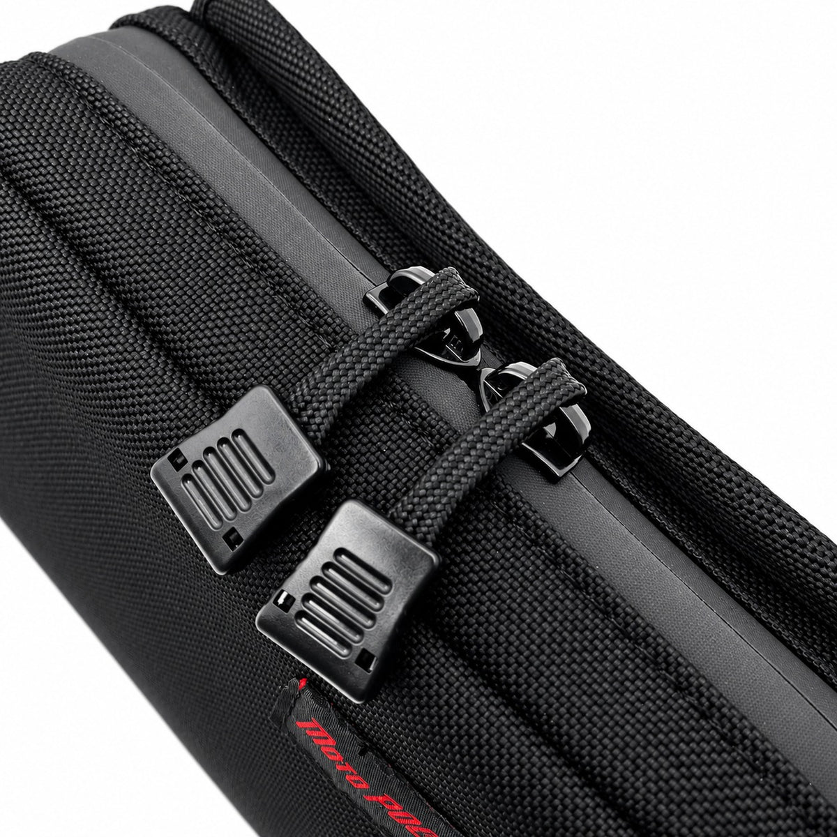 Close-up of Moto Pockets Mini T-Bar motorcycle handlebar bag showing YKK water-resistant zipper, dual easy-grip zipper pulls, and durable black Cordura fabric.