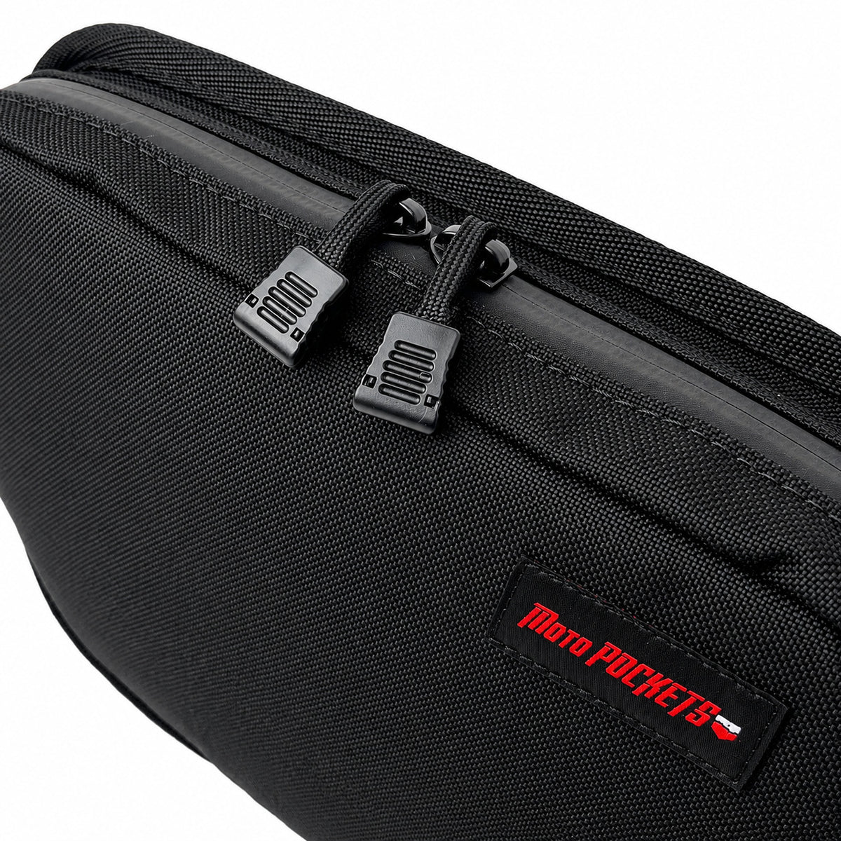 Close-up of black Moto Pockets OG T-Bar motorcycle handlebar bag showing dual easy-grip zipper pulls, water-resistant YKK zipper, durable Cordura fabric, and reinforced stitching.
