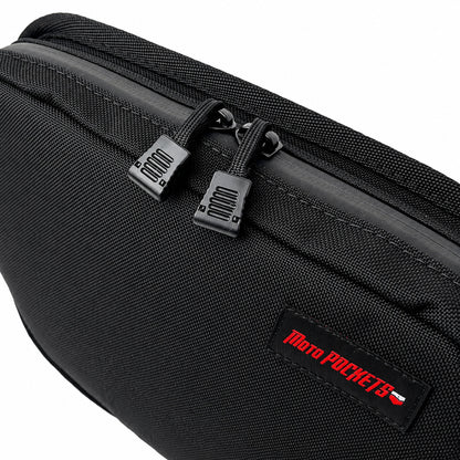 Close-up of black Moto Pockets OG T-Bar motorcycle handlebar bag showing dual easy-grip zipper pulls, water-resistant YKK zipper, durable Cordura fabric, and reinforced stitching.